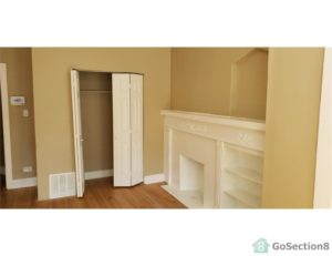 An image of an unfurnished room with empty closet