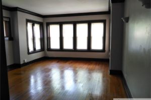 An image of an empty unfurnished room with large windows in series
