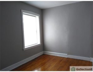 An empty unfurnished room with window